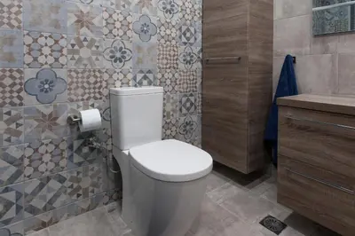 a bathroom with a white toilet and a sink at Lovely 2 bedroom apt in Metaxourgio Center in Athens
