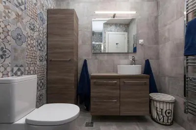 a bathroom with a toilet and a sink and a mirror at Lovely 2 bedroom apt in Metaxourgio Center in Athens