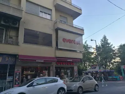 two cars parked in front of a building at Comfortable & Convenient Living in Athens in Athens