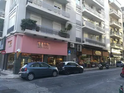 two cars parked in front of a building at Comfortable & Convenient Living in Athens in Athens