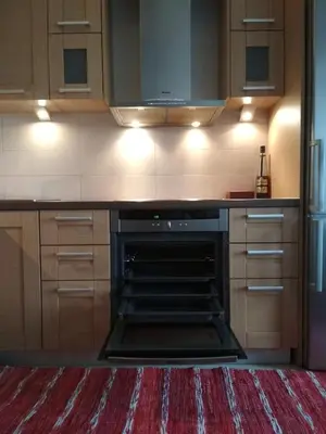 a kitchen with an oven in the middle at George's Apartment in Athens