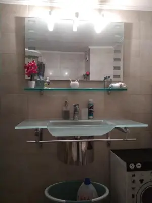 a bathroom with a sink and a mirror at George's Apartment in Athens