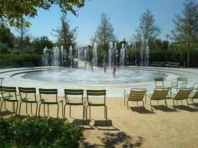 a group of chairs in front of a fountain at George's Apartment in Athens