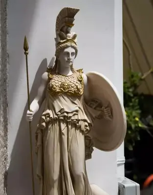 a statue of a woman holding a wand at Acropolis Suites - Where else in Athens? in Athens