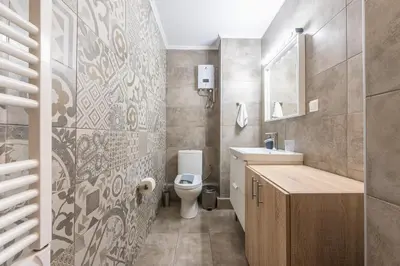 a bathroom with a toilet and a sink at Let me Athens you! in Athens