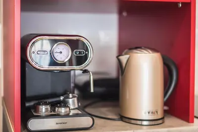 a coffeemaker and a coffee maker on a counter at Let me Athens you! in Athens