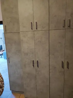 a large metal cabinet in a room at Serenity Villa-1st floor-Panoramic Sea view- sea 150m away in Porto Rafti