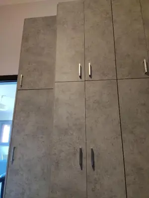 a large gray cabinet with silver handles at Serenity Villa-1st floor-Panoramic Sea view- sea 150m away in Porto Rafti