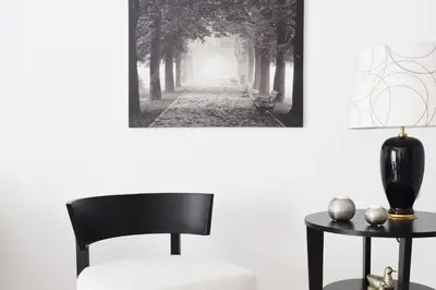 a black and white picture of a forested road at Poseidon by Heloni Apartments in Piraeus