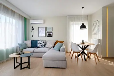 a living room with a couch and a table at Hercules Residence in Athens