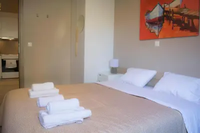a bedroom with a bed with towels on it at Chic and Minimal apartment close to Thissio Metro in Athens