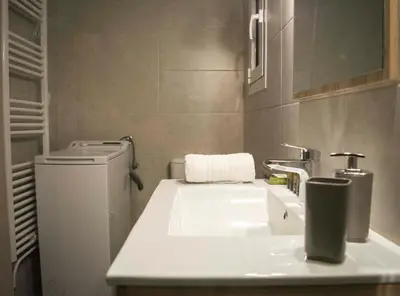 a bathroom with a sink and a toilet at Chic and Minimal apartment close to Thissio Metro in Athens