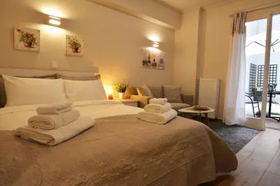 a bedroom with a bed with towels on it at Studio Posh with garden in Kolonaki in Athens