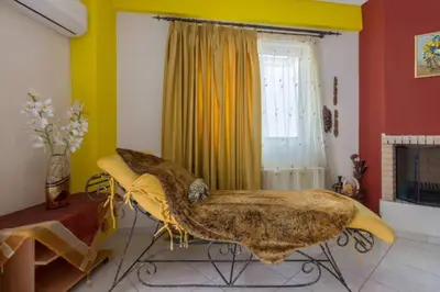 a room with a large bed in a room at Nea Smirni Luxury Apartment in Athens