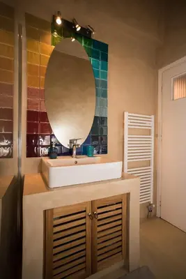 a bathroom with a sink and a mirror at 2 BEDROOM APARTMENT AT THE HISTORICAL CENTER, VIEW TO ACROPOLIS in Athens