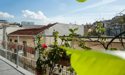 a view from the balcony of a building at 2 BEDROOM APARTMENT AT THE HISTORICAL CENTER, VIEW TO ACROPOLIS in Athens