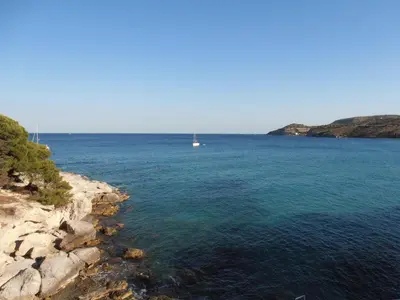 a large body of water with a boat in it at Hotel 3 Adelfia in Agia Marina Aegina