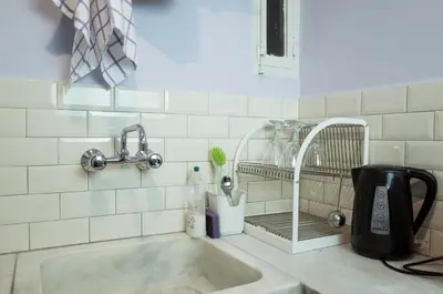 a kitchen counter with a sink and a faucet at THE HOUSE OF LAVENDER in Athens