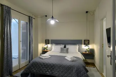 a bedroom with a bed with two towels on it at Amazing apartment in Kolonaki in Athens
