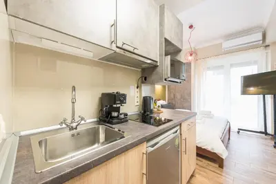 a kitchen with a sink and a counter top at Let me Athens you! #3 in Athens
