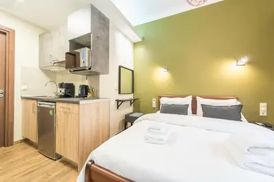 a hotel room with a bed and a kitchen at Let me Athens you! #3 in Athens