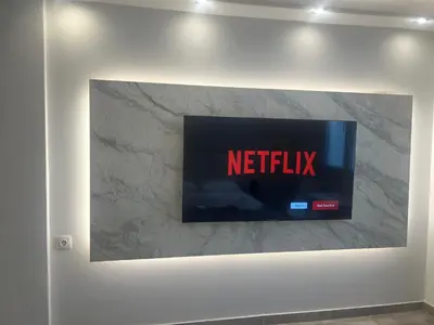 a wall with a tv on a wall at Purple- Lux studio 2' from metro Petralona in Athens