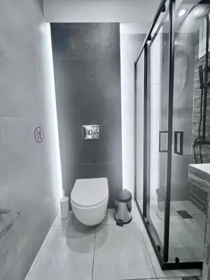 a bathroom with a toilet and a shower at Purple- Lux studio 2' from metro Petralona in Athens