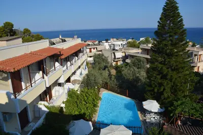 an aerial view of buildings and a swimming pool at Voula Apartments in Agia Marina Aegina
