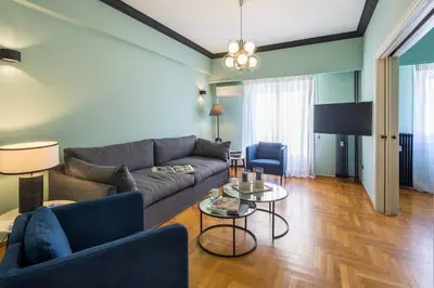 a living room with a couch and a table at Cathedrals square supreme residence in Athens