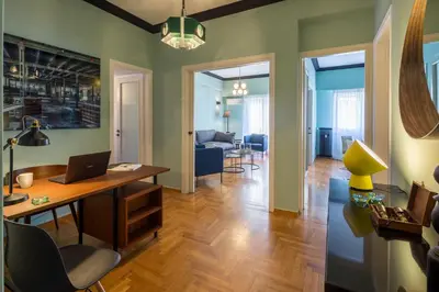 a living room with a desk with a laptop on it at Cathedrals square supreme residence in Athens