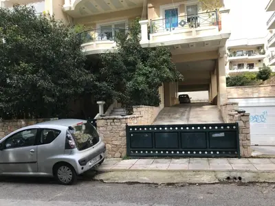 a small silver car parked in front of a building at Jacuzzi studio close to athens airport!! in Pallíni