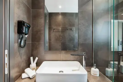 a bathroom with a sink and a shower at Ma Maison No1 Penthouse, Acropolis view, 315 Mbps in Athens