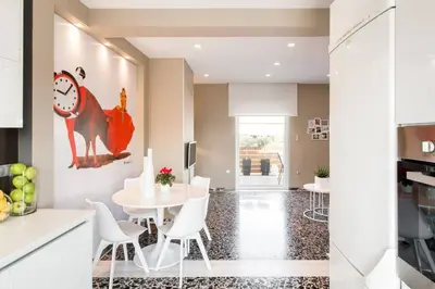 a kitchen and dining room with a table and chairs at Ma Maison No1 Penthouse, Acropolis view, 315 Mbps in Athens