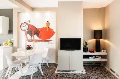 a dining room with a table and a tv at Ma Maison No1 Penthouse, Acropolis view, 315 Mbps in Athens