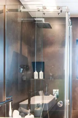a bathroom with a shower with a sink at Ma Maison No1 Penthouse, Acropolis view, 315 Mbps in Athens