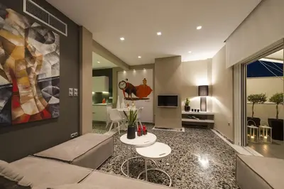 a living room with a couch and a table at Ma Maison No1 Penthouse, Acropolis view, 315 Mbps in Athens