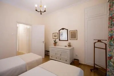 a bedroom with two beds and a mirror and a dresser at 