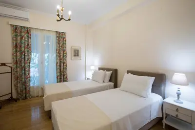 a bedroom with two beds and a window at 