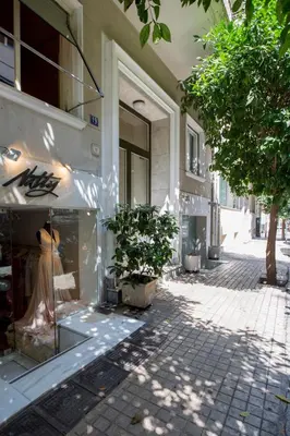 a store front with a dress in a store window at 