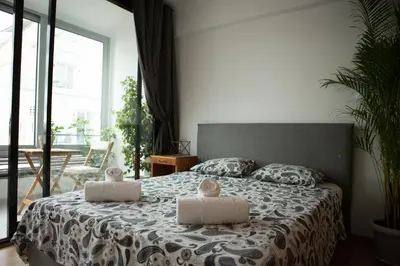 a bedroom with a bed with two pillows on it at Mosaics aprtm in the historical center of Athens Ermou 18 in Athens