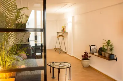 a room with a table and some plants at Mosaics aprtm in the historical center of Athens Ermou 18 in Athens