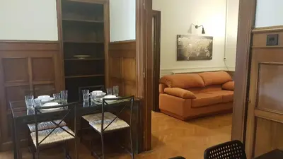 a living room with a glass table and a couch at Violet Errathens Apartment - Athens Center, 7 BD, 3 BATH in Athens