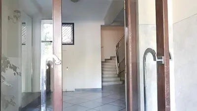 a hallway of a house with a door and stairs at Violet Errathens Apartment - Athens Center, 7 BD, 3 BATH in Athens