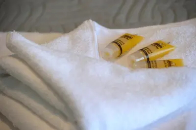 a pair ofages and a tube of toothpaste on a white towel at Smart renovated studio downtown Athens in Athens