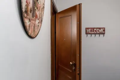 a brown door with a sign next to it at Athens Flower Apartment in Athens