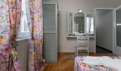 a room with a bed and a mirror at Athens Flower Apartment in Athens