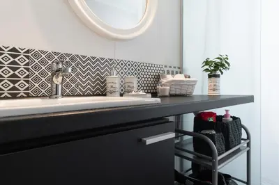 a bathroom with a sink and a mirror at Athens Flower Apartment in Athens