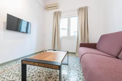 a living room with a couch and a coffee table at Athens Oasis in Athens