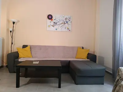 a living room with a couch and a table at Top GroundFloor in Mets in Athens