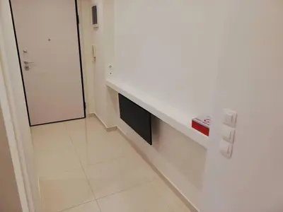 a white kitchen with a counter and a refrigerator at White Lux Apartment For 2 VIPGreece in Athens